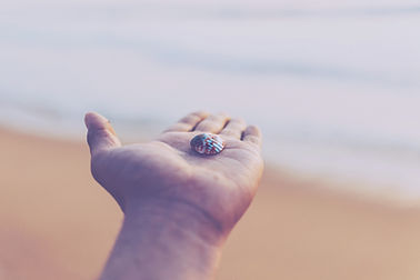 Outstretched hand with shell in it
