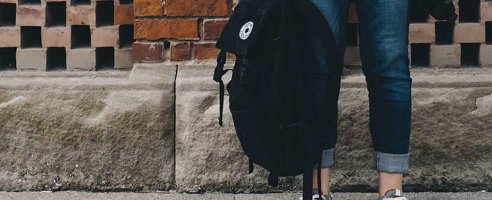 Student holding backpack
