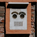 Apartment intercom with facial graffiti