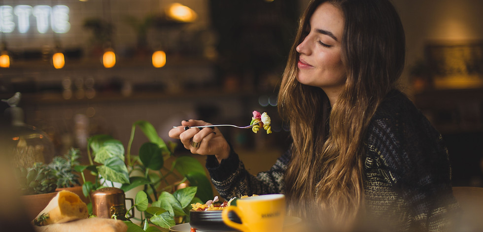 Woman enjoying Ayurvedic lunch using Ayurvedic recipe provided by AyurLife UK Holisitic Wellness Coach Faith Warner