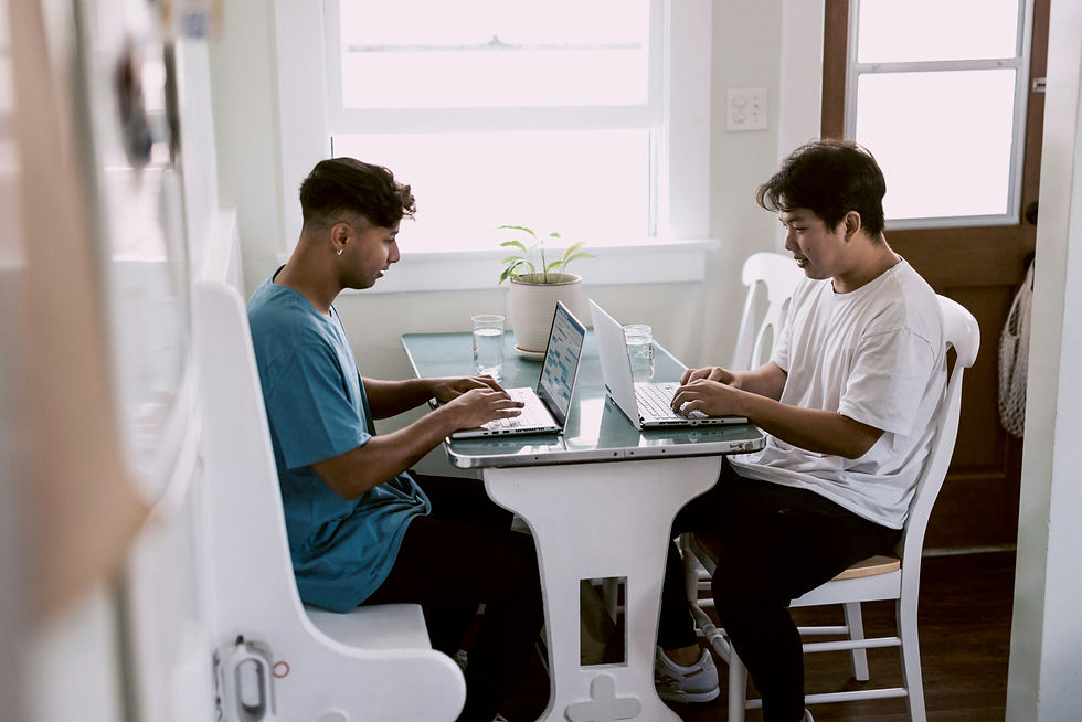 A caring lawyer from The Accident Network Law Group listens to an injured client while reviewing case papers in a comfortable, professional office space.