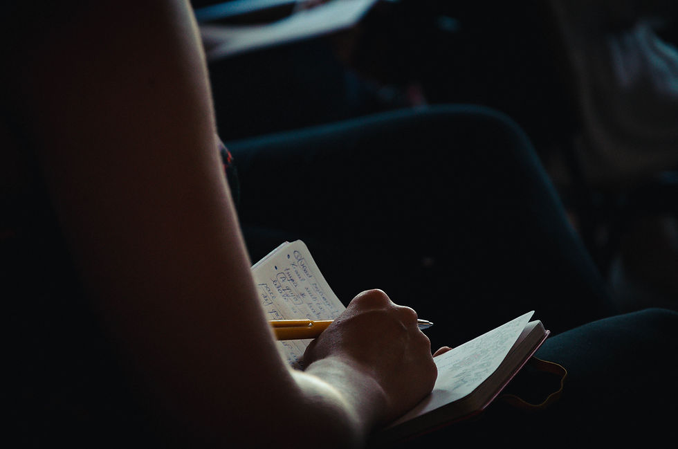 Hand writing on diary with yellow pen