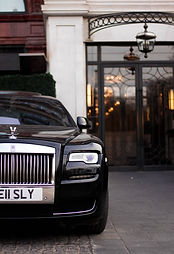 Black Rolls Royce with Hotel background Image by Zoe Holling