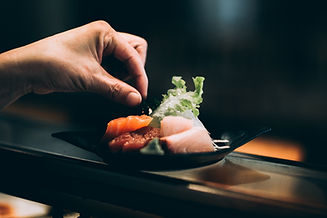 Fresh sushi on a bed of lettuce.