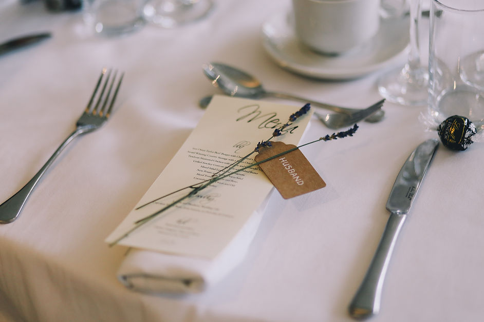 Wedding table place setting with wedding meni