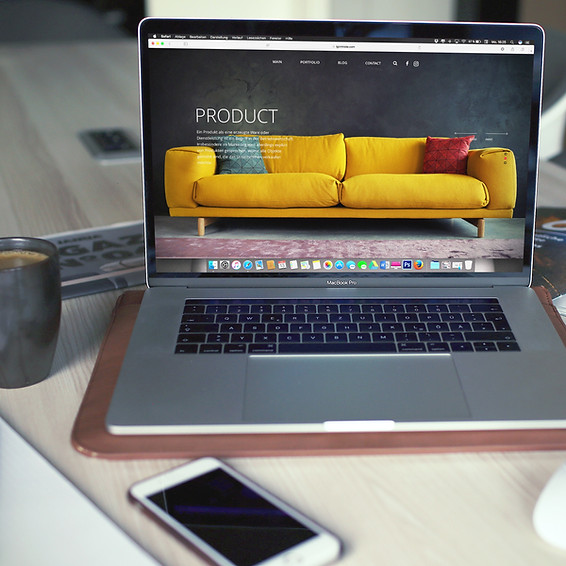 Website shown on a laptop with a mobile phone