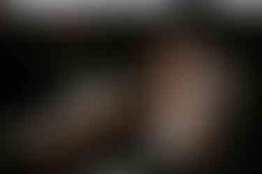 A lady drops essential oils onto her hands