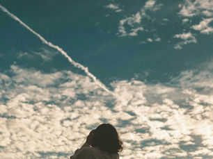Woman looking at the sky