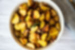 roasted potatoes in white bowl