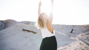 A woman celebrating in nature