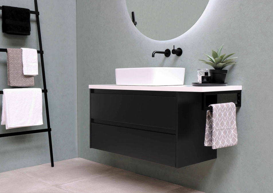Bathroom with floating vanity, round mirror, and soft lighting