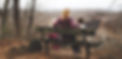 woman sitting on a bench on a hike with kids