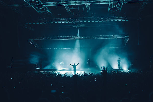 A singer on stage interacting with a crowd