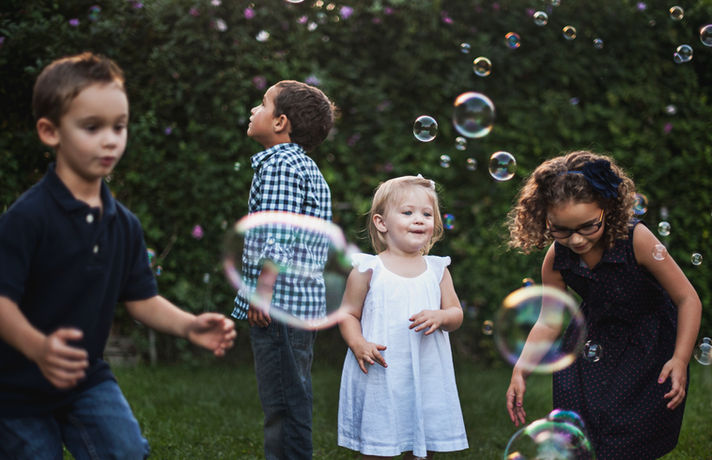 Kids Blowing Air Bubbles