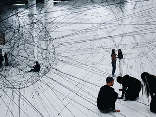 People navigating a web of interconnected lines, representing systemic barriers and different pathways through information and interfaces.