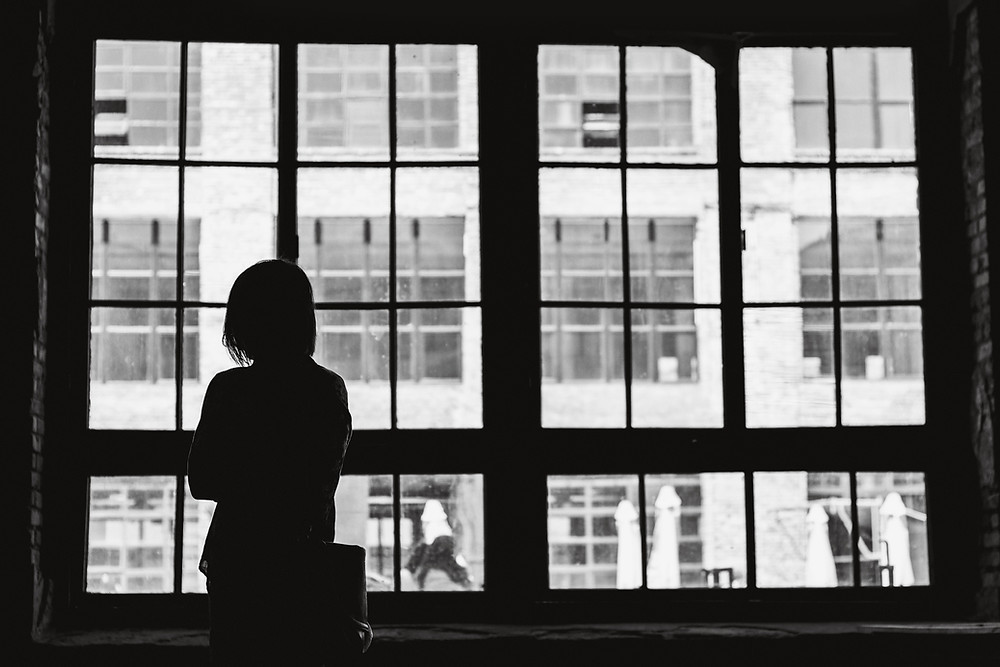 person looking out a window