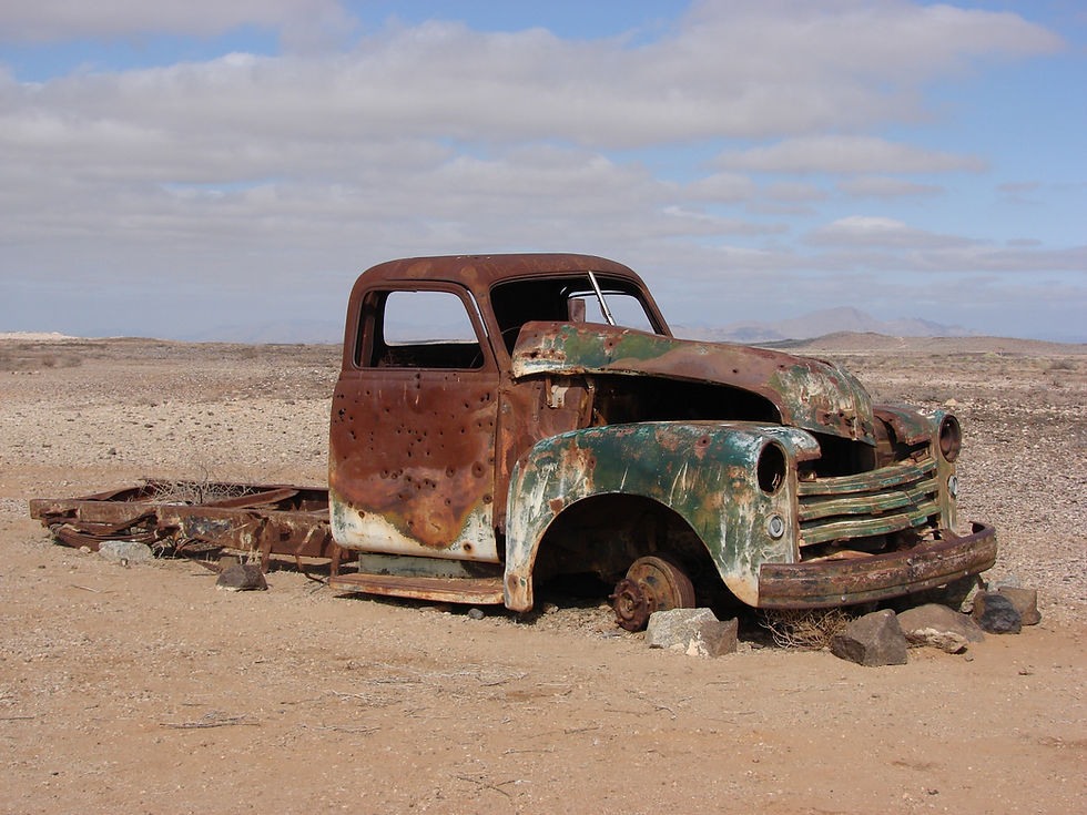 Rusty truck stuck in desert