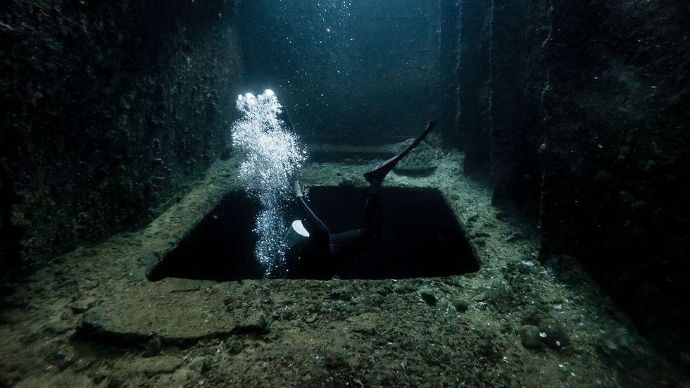 Diver searching in open pit for opportunities