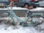 picture of bicycle stuck in the mud or snow. 
