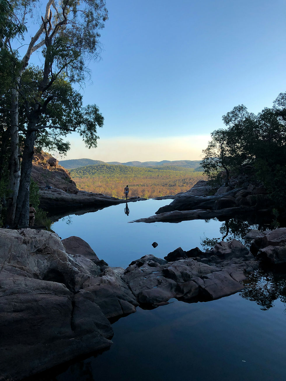 Hiker overlooking a natural pool in Australia's Top End. Image by Bart van Griensven