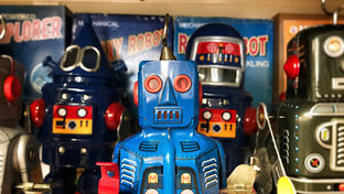 Group of tin vintage robots in various colours