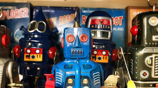Group of tin vintage robots in various colours