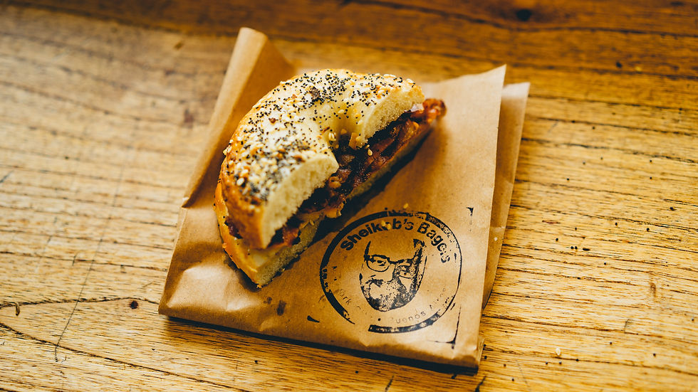 half a bagel on a paper bag