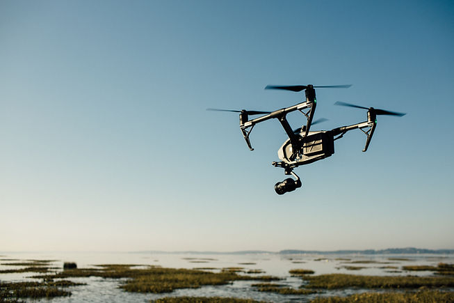 Drone flying in the skiy filming