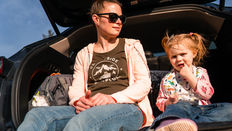 Child caught between two parents in a high-conflict separation showing signs of parental alienation — Dr. Lyndsay Elliott