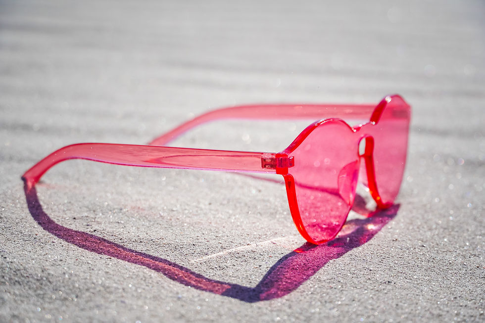 pink glasses on pavement