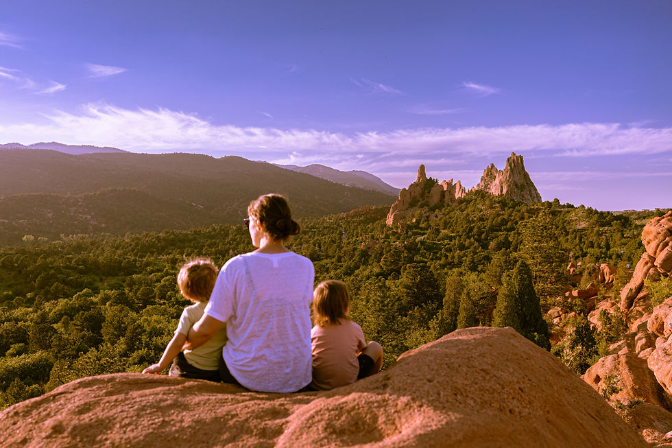 Mother and children in Colorado landscape representing child therapy support in Littleton, CO.