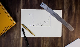 Sales projections on a white board.