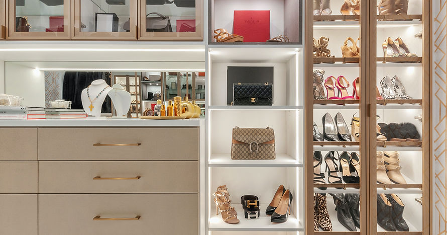 Primary walk-in closet after Home Organization Seminole services, neatly styled and luxurious