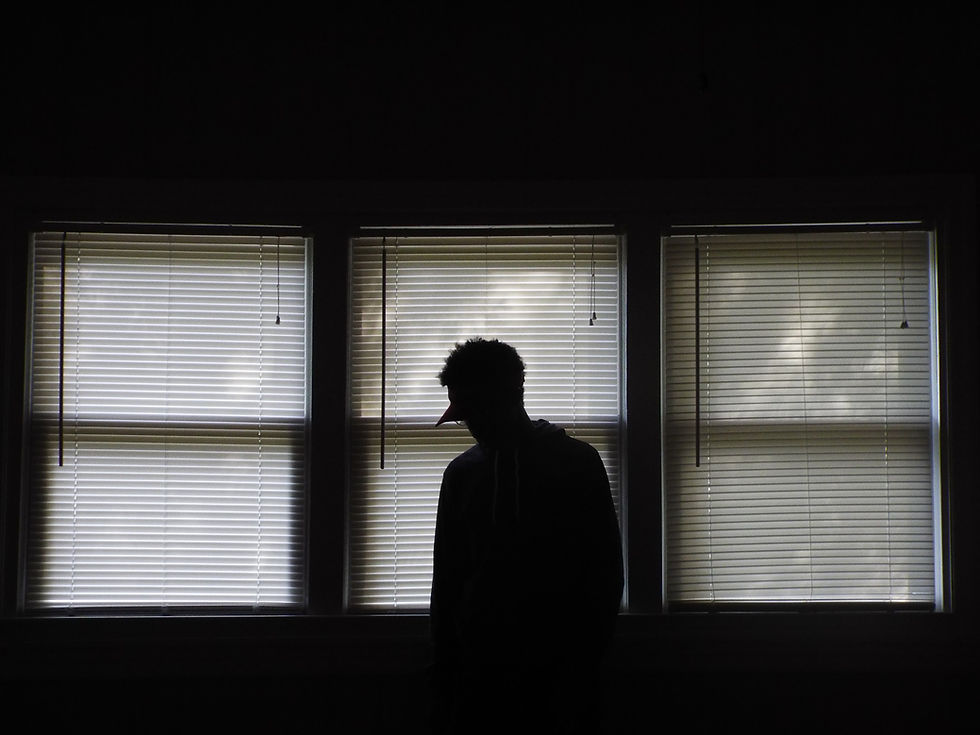 https://privacyx.me man standing against window in shadow