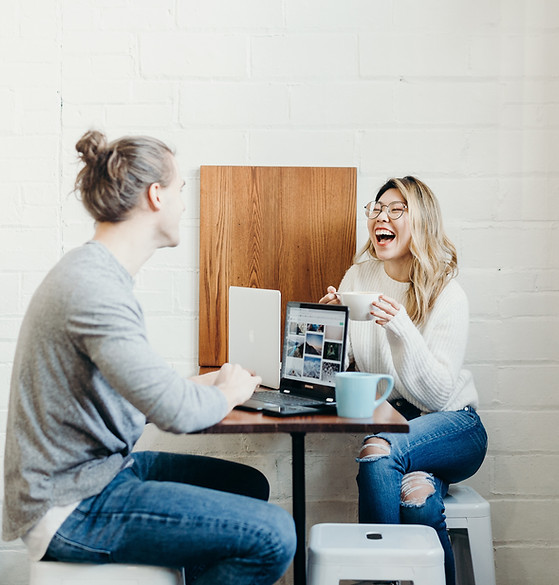 Two people in a meeting over coffee, Image by Brooke Cagle