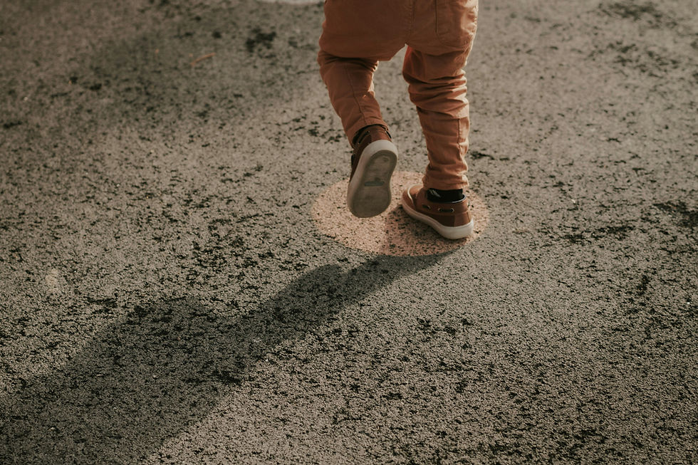 Eye-level view of a child playing with building blocks