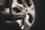Tire shop replacing new tires on BMW wheels
