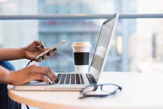 Woman working on a laptop.