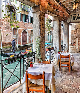 Dining along a canal in Venice