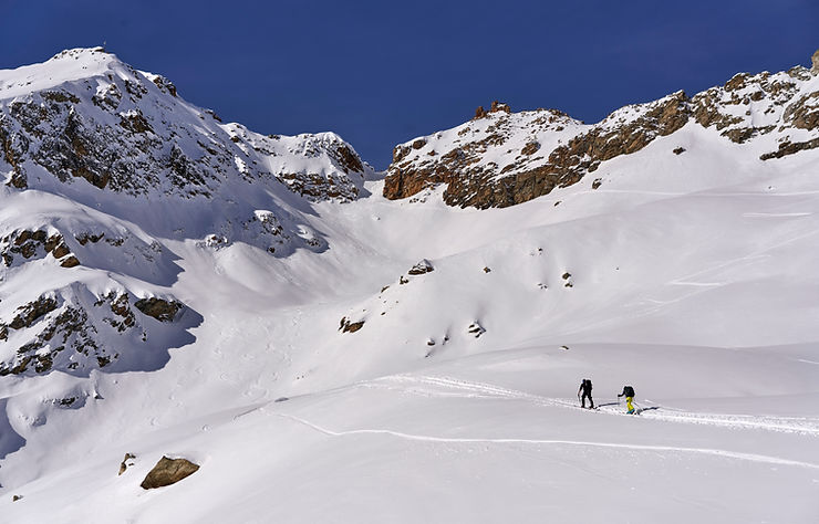 People climbing a snowy mountain