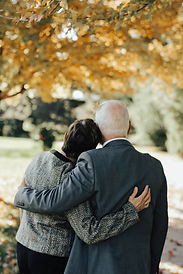 couple supporting eachother at a funeral