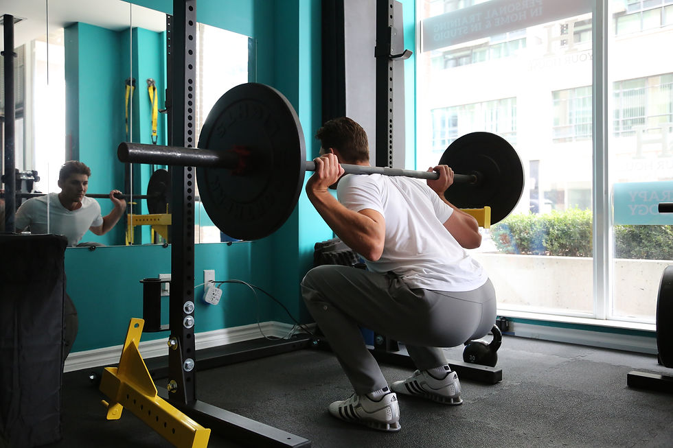 Man doing squats and building muscle in his quads and glutes