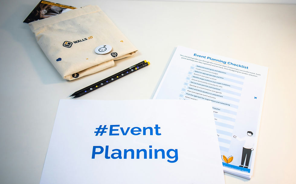 Event planning materials on a white desk: #Event Planning sheet, checklist, pencils, and WALLS.IO pouch with a pin.