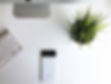Minimal white office workspace used as a background image for audiology marketing FAQs