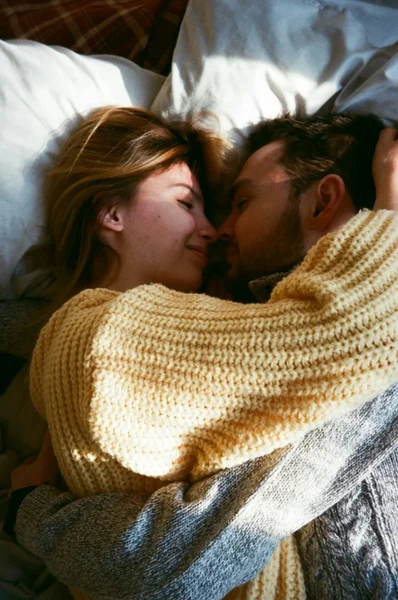 Sex after baby - couple sharing intimacy 
