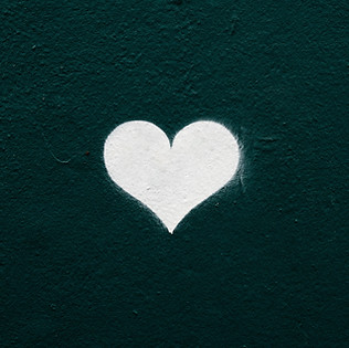 A white heart with a green background