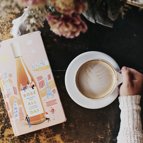 Flat lay of a coffee cup beside a lifestyle magazine and a laptop, symbolizing a cozy workspace for lifestyle bloggers building their personal brand.