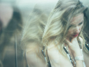 Woman appearing emotionally unsettled, illustrating relationship insecurity explored in therapy.