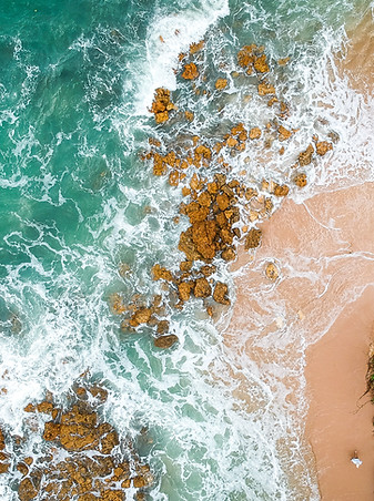 Sea on rocks and sand - unsplash photo credit to the talented thiago japyassu - thank you!