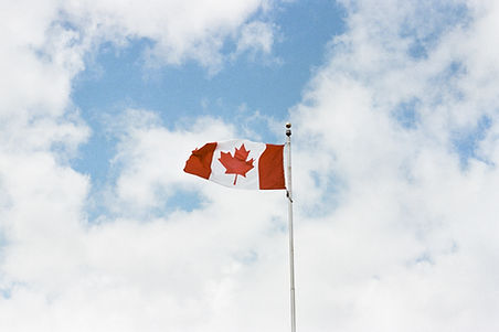 Proudly waving Canadian flag representing our hotel's proximity to Ottawa's International Airport, your ideal choice for convenience and comfort during your stay